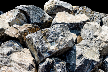 A pile of big stones on black background