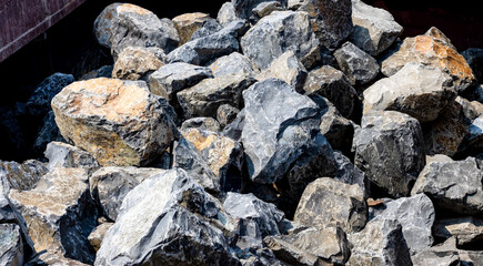 Close up view of a large stones heap on a big container