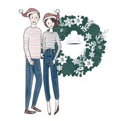 サンタクロース帽子の男女とクリスマスリース
