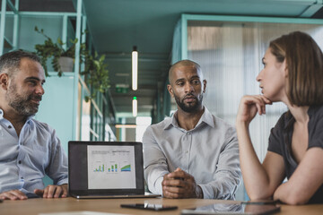 African American businessman leading a corporate meeting