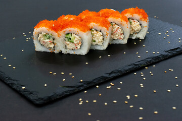 California Maki Sushi with Masago - Roll made of Crab Meat, Avocado, Cucumber inside