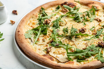 Fruit homemade sweet pear pizza with blue cheese, walnut and arugula