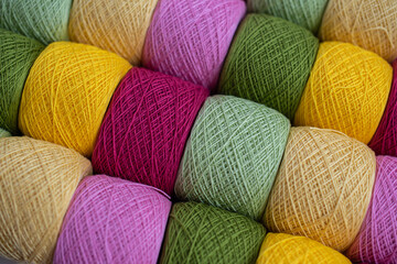 Knitting needles, colorful threads. Knitting pattern of colorful yarn wool on shopfront. Knitting...