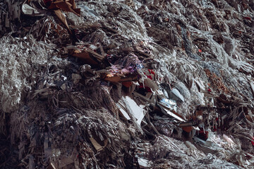 Close-up photo of a large amount of garbage and rubbish at the dump