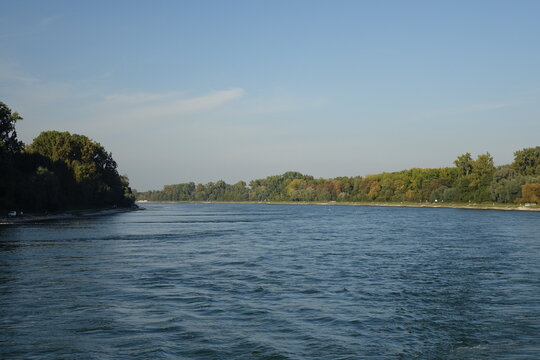 Eastern Rhine shore seen from the river on a cold and sunny autumn day, Maxau, Karlsruhe, Baden-Wurttemberg, Germany

