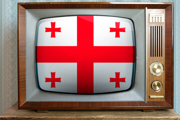 old tube vintage tv with the national flag of georgia on the screen, the concept of eternal values ​​on television, global world trade, politics, retro technology