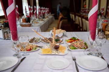 Laid buffet table. Salads and appetizers on the festive served table. Tasty food.