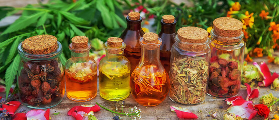 Bottled herbal and flower tinctures. Selective focus.