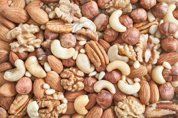 Different nuts. Assortment healthy snacks. Mediterranean diet. Dry vegan charcuterie. Variety party pile. Fat nutrients. Cashews, walnuts, almonds, pecans, pine, brazil, macadamia, hazelnuts, peanuts
