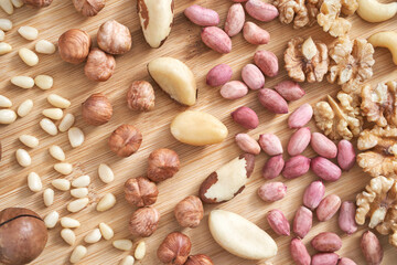 Different nuts. Assortment healthy snacks. Mediterranean diet. Dry vegan charcuterie. Variety party pile. Fat nutrients. Cashews, walnuts, almonds, pecans, pine, brazil, macadamia, hazelnuts, peanuts