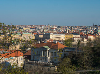 Fototapeta na wymiar Scenic aerial view of Prague Old Town architecture roof top seen from Letna hill park, spring sunny day, blue sky, Czech Republic