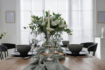 Festive table setting with beautiful tableware and decor indoors