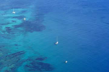 Aerial view of boats standing in the sea with transparent waters. Calpe Alicante.