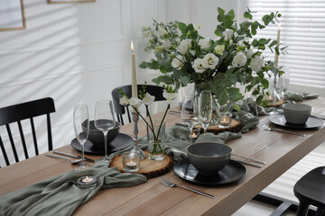 Festive table setting with beautiful tableware and decor indoors
