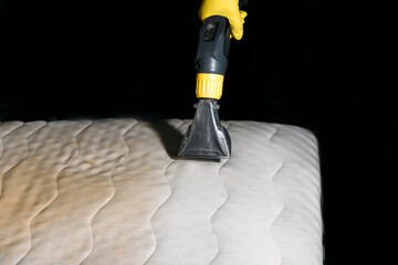 cleaning the mattress with a cleaning vacuum cleaner