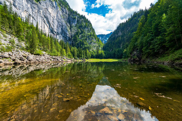 The legendary Lake Kammersee, Ausseer Land, Styria, Austria, is enclosed by mountains and a primeval forest, reachable only by boat via Lake Toplitz