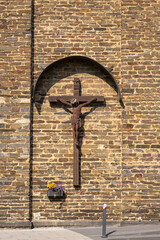 Crucifix on the facade of the church of Kobern-Gondorf / Germany 