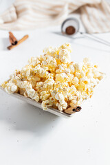 Cozy and aesthetic beige composition with popcorn. Autumn, winter food concept.