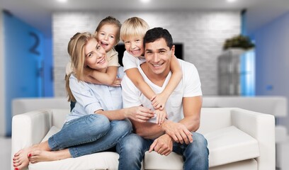 Cheerful happy young Family having Fun Together At Home