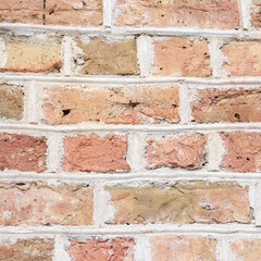 Orange house brick wall texture background with small details.