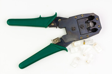 Modular plug crimper for RJ-45 and transparent connectors isolated on white background.