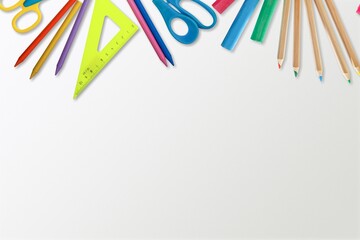 composition with school supplies on a background. Frame of colorful stationery.