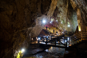 Explore the depth inside the Stopica cave - limestone formation with stalactites, stalagmites and...