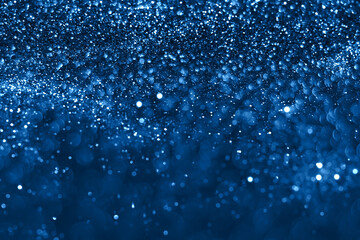 Naklejka na ściany i meble Blue sparkling glitter bokeh background, christmas abstract defocused texture. Holiday lights