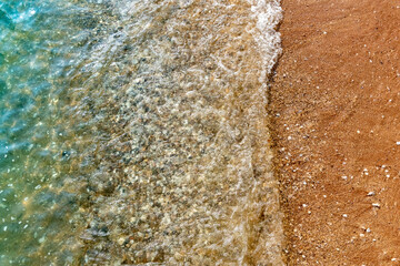 Nature in twilight period which including of sunrise over the sea and the nice beach. Summer beach with blue water and purple sky at the sunset.	
