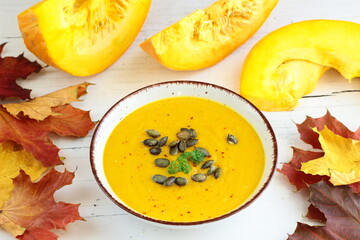 Homemade pumpkin soup sprinkled with pumpkin seeds