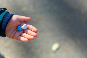 heart shape candies in the hand 