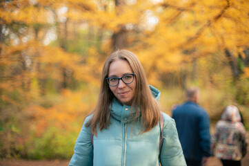 Autumn portrait of beautiful woman on fall nature background