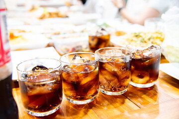 Refreshing Bubbly Soda Pop with Ice Cubes. Cold soda iced drink in a glasses - Selective focus, shallow DOF	
