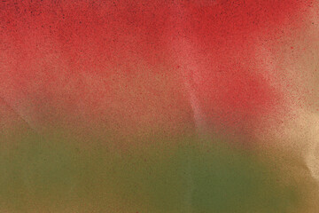 red and green spray paint on gold colored paper