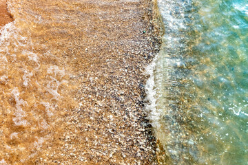 Nature in twilight period which including of sunrise over the sea and the nice beach. Summer beach with blue water and purple sky at the sunset.	
