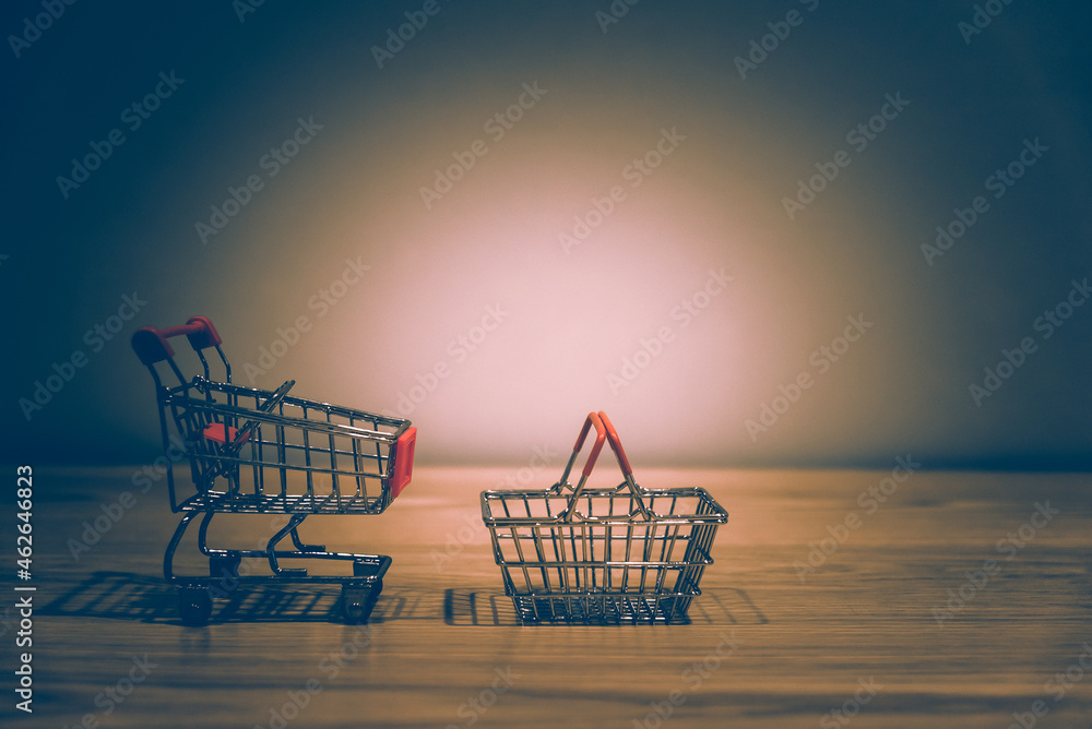 Poster close-up of shopping cart and on vintage retro background with some copy space for texting.