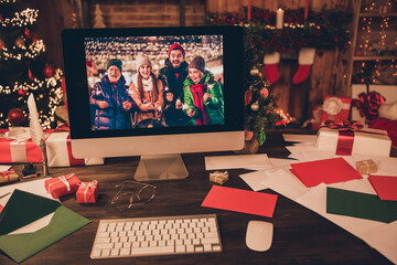 Photo of cozy santa claus house desk computer online video call people good mood noel eve indoors...