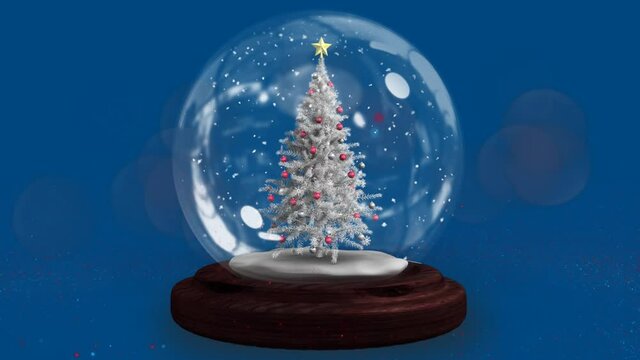 Two shooting stars spinning around christmas tree in a snow globe against blue background