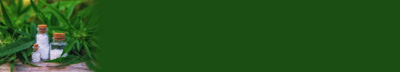 Marijuana oil in a small bottle. Selective focus.