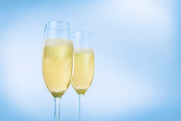 Champagne glasses. The second glass is a little bit blurred.