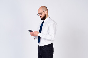 Attractive successful male businessman uses the phone.