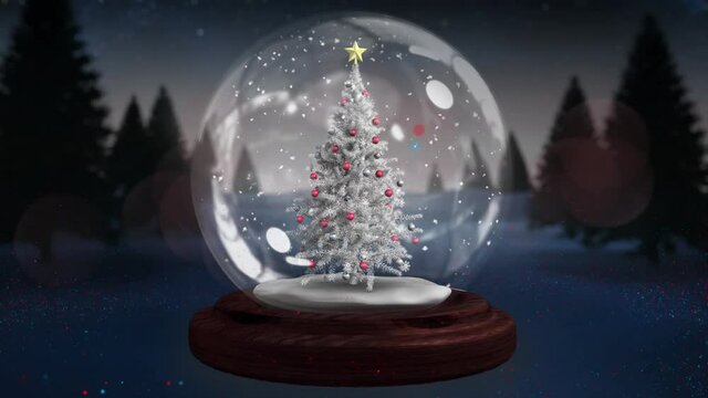 Blue shooting stars spinning around christmas tree in a snow globe on winter landscape