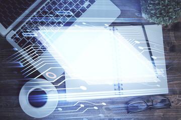 Multi exposure of data theme drawing hologram over topview work desk background with computer. Concept of technology.