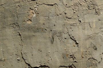 A pattern of frozen concrete, gray in color. Unusual background and texture of cement and concrete. Fancy patterns, complemented by light and shadow.