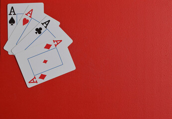 Playing cards. 4 aces. photo of playing cards red background. flat lay.