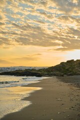 Fototapeta na wymiar Morning, sunrise at sea, natural seascape, the Greek city of Chania Crete on the horizon
