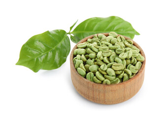 Wooden bowl with green coffee beans and fresh leaves on white background