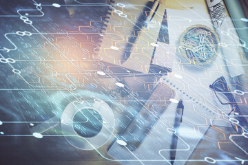 Double exposure of technology theme drawing over work table desktop. Top view. Global data analysis concept.