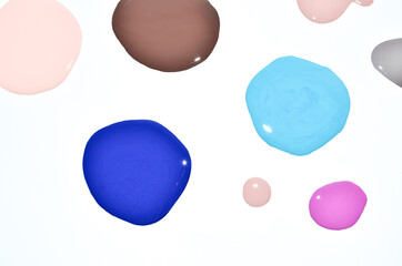 Nail polish (enamel) mixed multicolor samples, isolated on white background