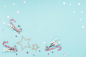 Naklejka premium Christmas or winter holiday composition. Card with snowflakes and red gift box on pastel blue background.